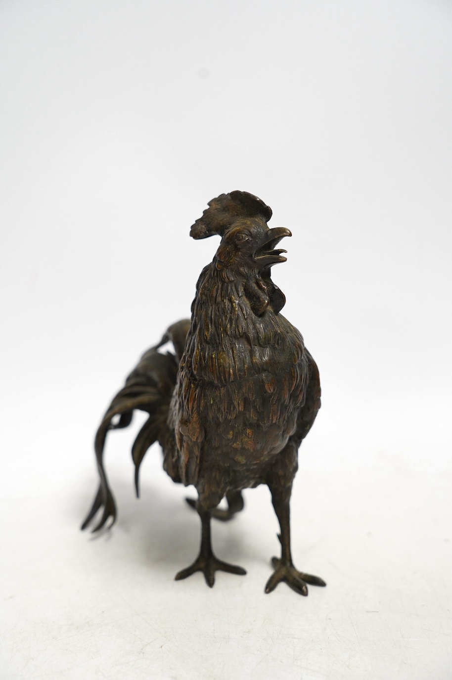 A bronze study of a cockerel, 17cm. Condition - good